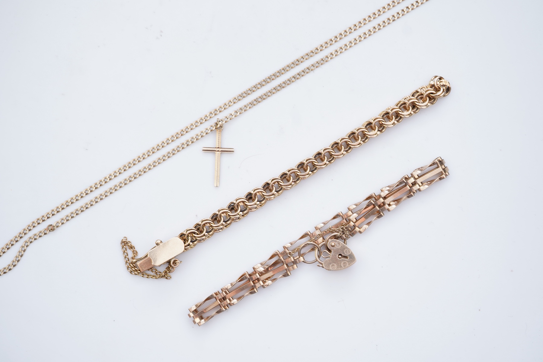 Two gold bracelets and a gold necklace